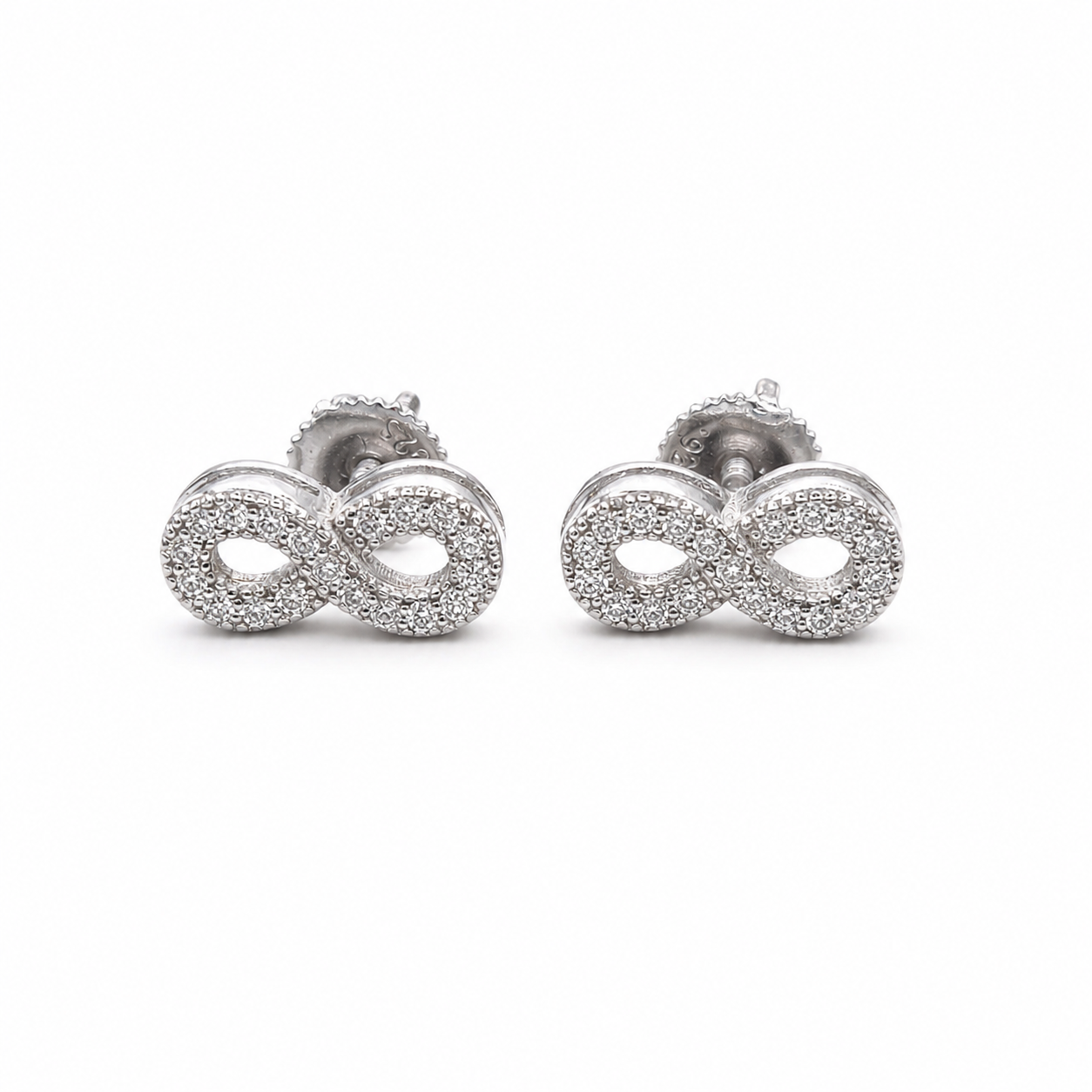 Pair of silver moissanite infinity stud earrings on clean white background